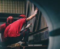 workers in red t shirts in factory