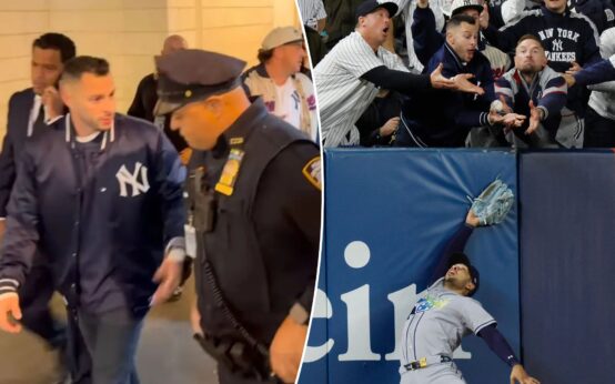Aficionado de los Yankees es escoltado fuera de Yankee Stadium tras interferir en la jugada de Anthony Volpe
